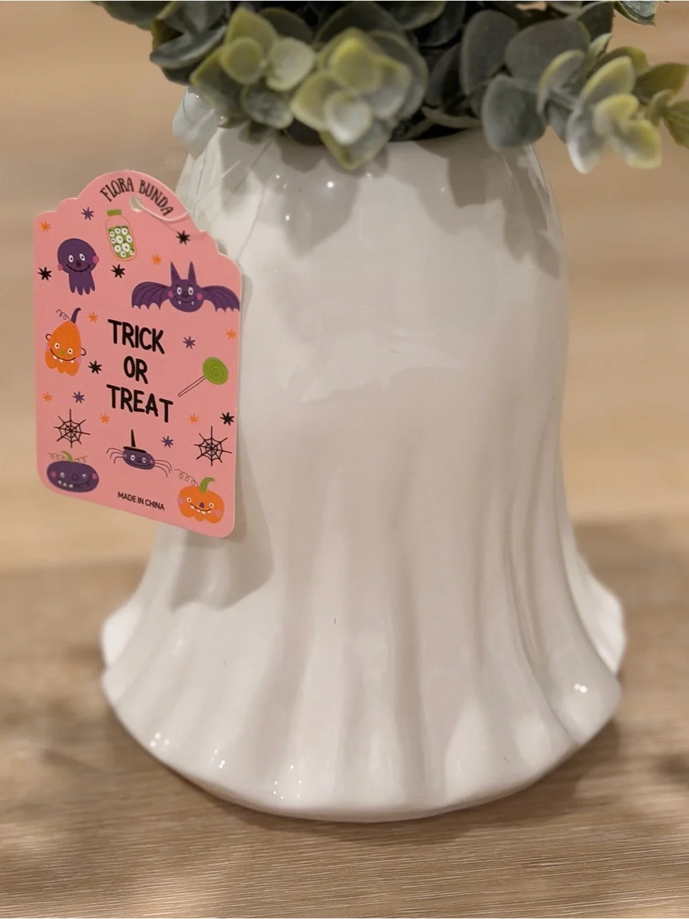 Ghost with floral crown holding books Planter with Greenery